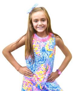 Early orthodontic treatment patient with metal braces and a bow in her hair