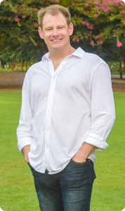 Orthodontist, Dr. Matt Culberson, standing with hands in pockets