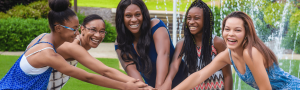 Five orthodontic treatment patients laughing and having fun