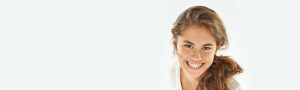Clear braces orthodontic patient smiling